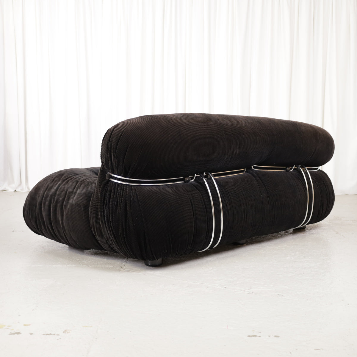 Cassina Soriana sofa in black corduroy – three-quarter rear view