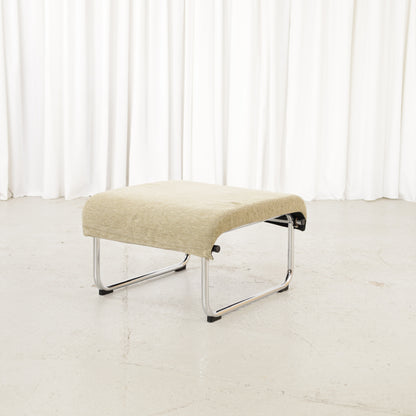 Green fabric Remmi ottoman, opposite angled view