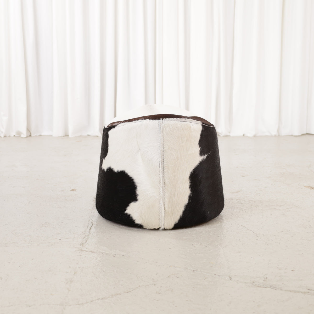 Niels Gammelgaard IKEA Stockholm cowhide swivel ottoman – Opposite end view