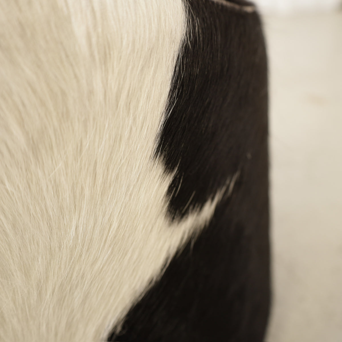 Niels Gammelgaard IKEA Stockholm cowhide swivel ottoman – Hair-on-hide upholstery detail