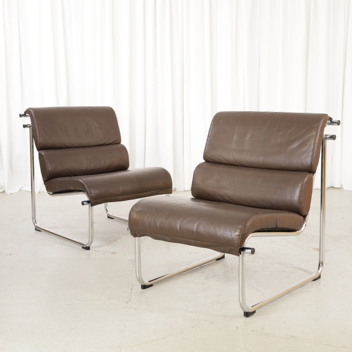 Yrjo Kukkapuro armless medium Remmi lounge chair in brown leather, chromed frame
