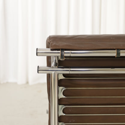 Yrjo Kukkapuro Remmi medium lounge chair, brown leather upholstery and chrome detail