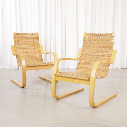 Alvar Aalto 406 rattan lounge chair, two chairs shown, sold individually