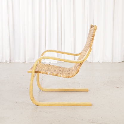 Alvar Aalto 406 rattan lounge chair, birch frame and woven rattan detail