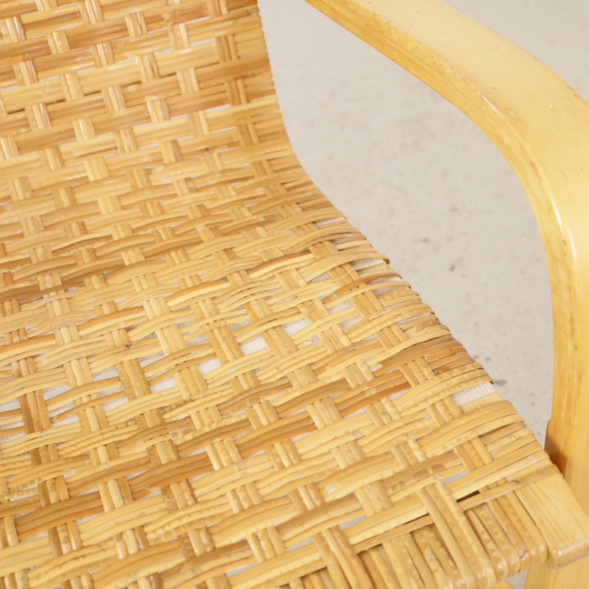 Alvar Aalto 406 lounge chair, worn and repaired rattan weave detail