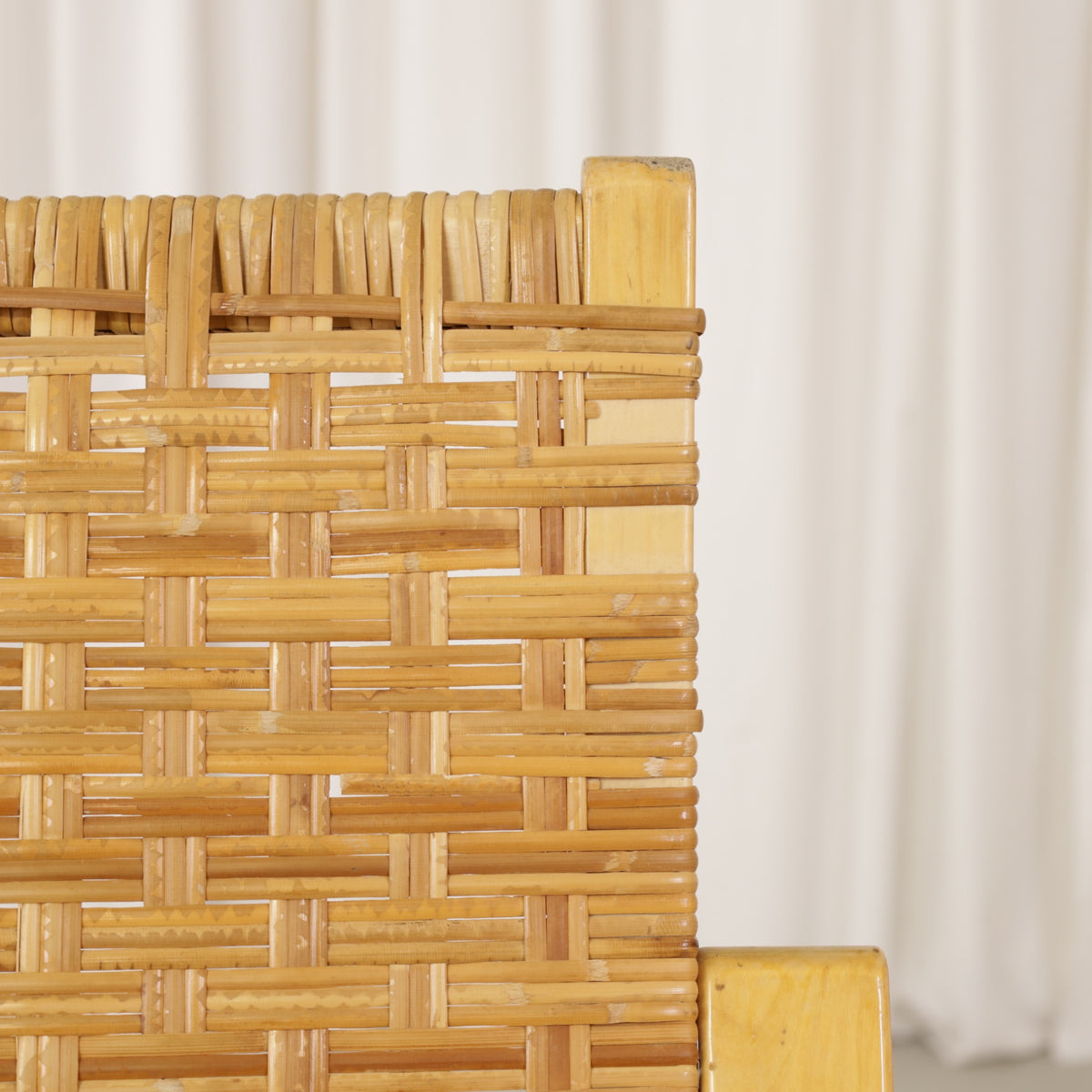 Alvar Aalto 406 lounge chair, worn and repaired rattan weave detail