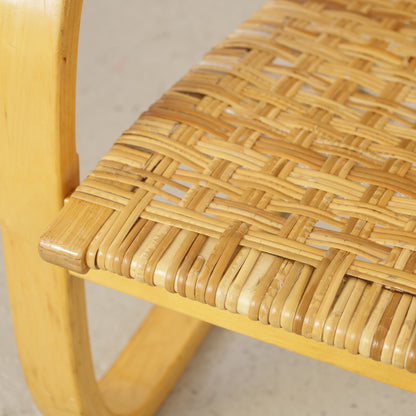 Alvar Aalto 406 lounge chair, worn and repaired rattan weave detail