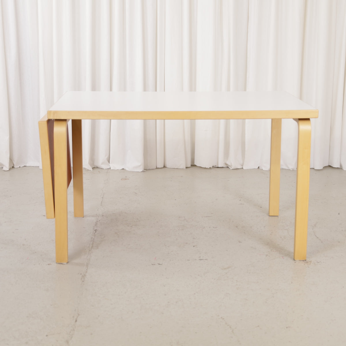 Alvar Aalto large drop-leaf table for Artek, white laminate top and birch frame