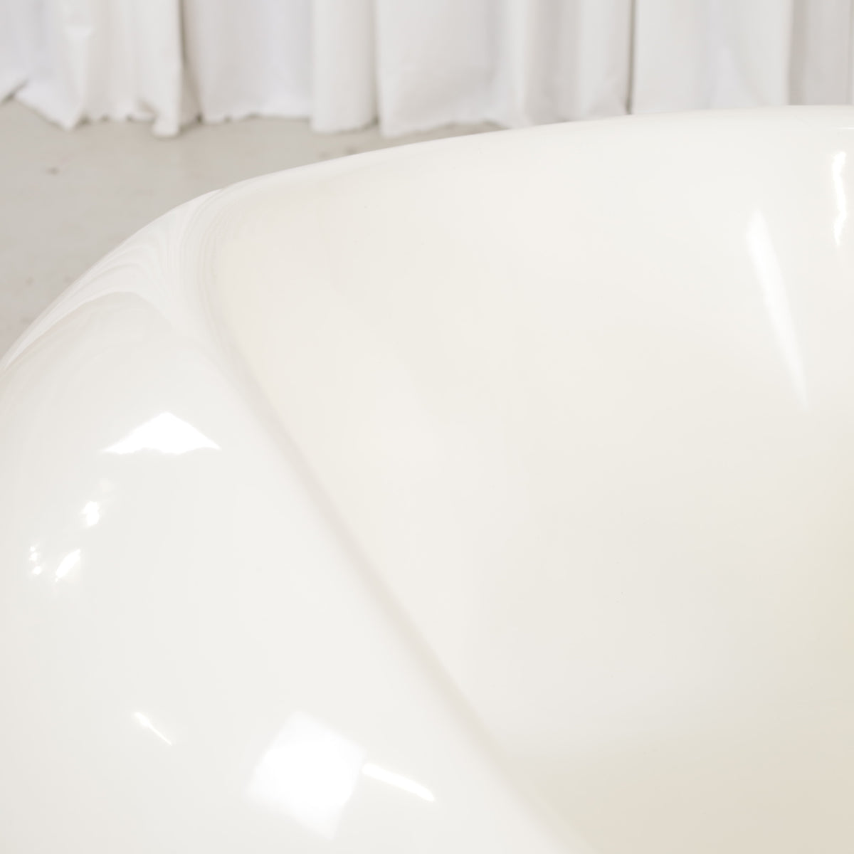 Detail of glossy white fibreglass seating surface