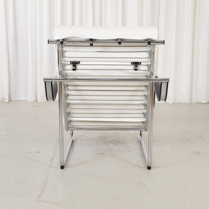 Rear view of Remmi chair with exposed chrome support structure