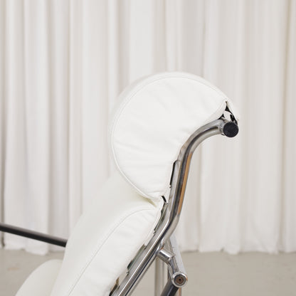 Detail of white leather head cushion and chrome frame