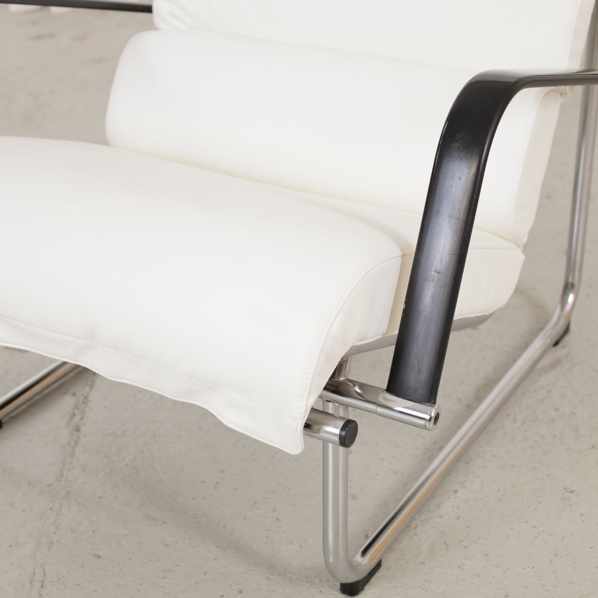 Remmi seat cushion, armrest and chrome joint detail