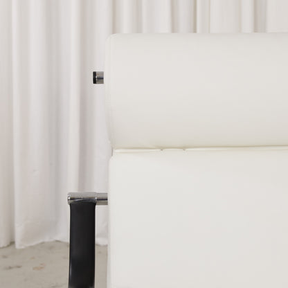 White leather cushion seams and chrome frame detail