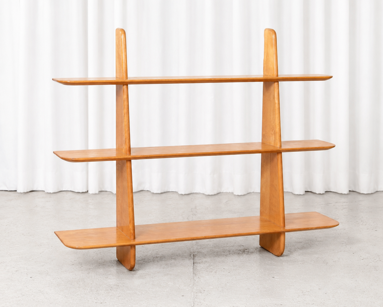 Vintage Leo bookshelf designed by Ilmari Lappalainen for Asko in the 1950s. Lacquered birch, sculptural open construction and very good vintage condition. Width 105 cm.