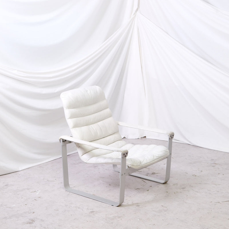 Rare Ilmari Lappalainen Pulkka prototype chair for Asko in white leather with metal frame. Vintage Finnish design with original Asko label.
