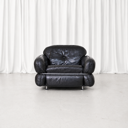 Vintage Isku Hannibal armchair designed by Kurt Hvitsjö in the 1970s, featuring original black leather upholstery and a distinctive tubular chrome frame.