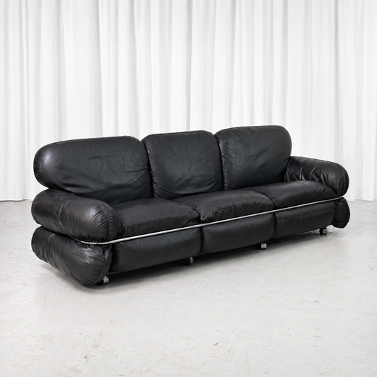 Vintage Hannibal sofa designed by Kurt Hvitsjö for Isku, featuring soft black leather upholstery, rounded cushions and a distinctive chrome frame.