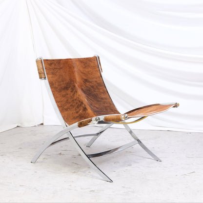 Vintage Scissor chair by Antonio Citterio with pony hair leather sling and chrome frame. Sculptural Italian lounge chair design.
