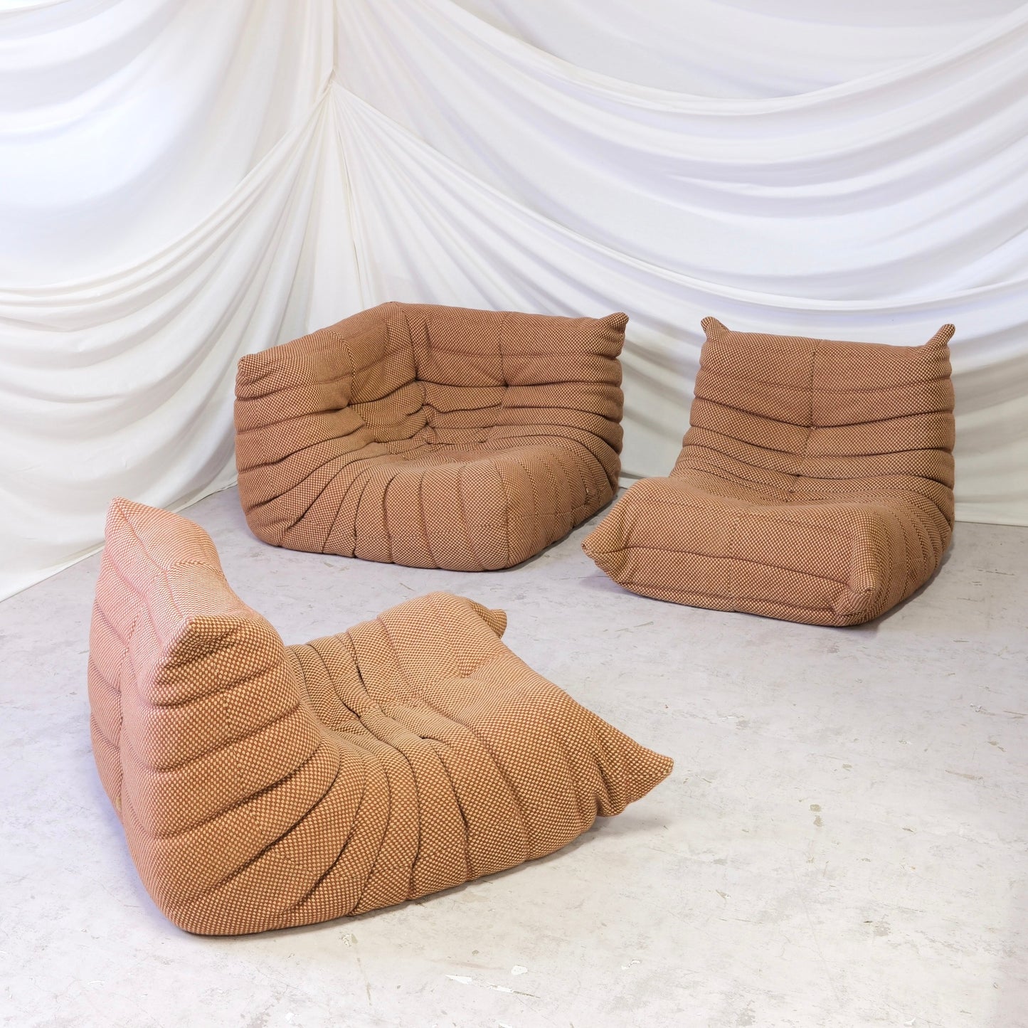 Vintage Ligne Roset Togo set by Michel Ducaroy with two fireside chairs and corner element in brown checked wool fabric. Worldwide shipping available.