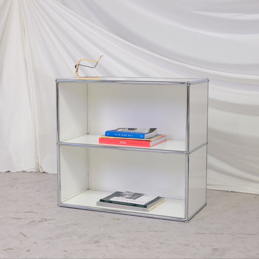 USM Haller open shelving unit in white with chrome frame. Compact modular storage shelf suitable for books, objects, or office use. Worldwide shipping available.