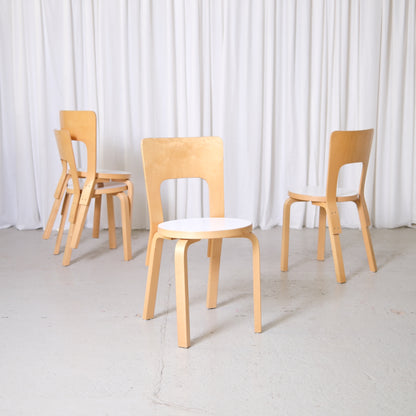 Vintage Alvar Aalto Artek 66 chairs with birch frames and white laminate seats