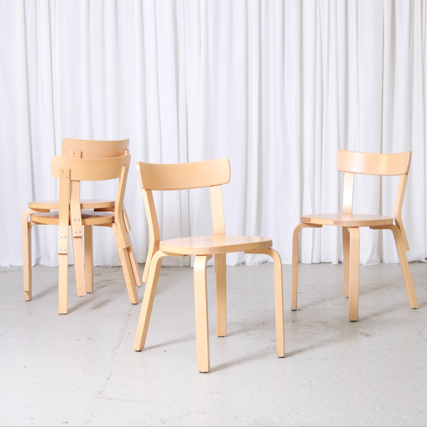Vintage Alvar Aalto Artek 69 chairs in birch with rounded seats and simple backrests