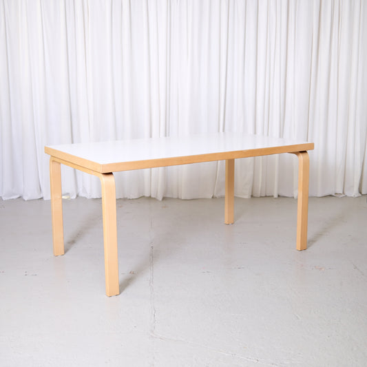 Vintage Alvar Aalto Artek 82A table with white laminate top and birch legs, Finnish design dining table photographed at Pino Interiors Helsinki.