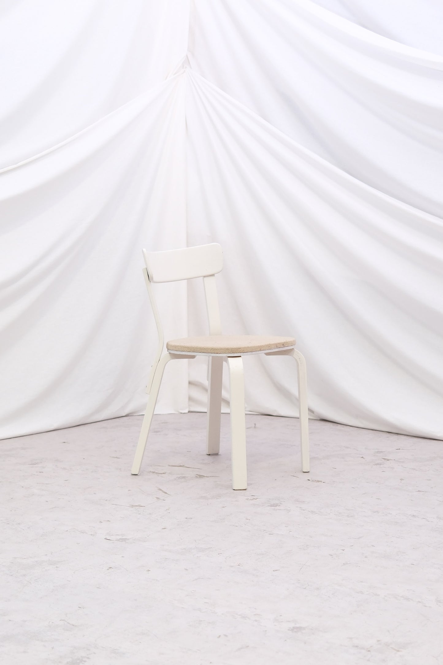 Vintage Alvar Aalto Chair 69 “Sandwich” by Artek with original upholstery and white painted finish with patina. Helsinki pickup and worldwide shipping available.