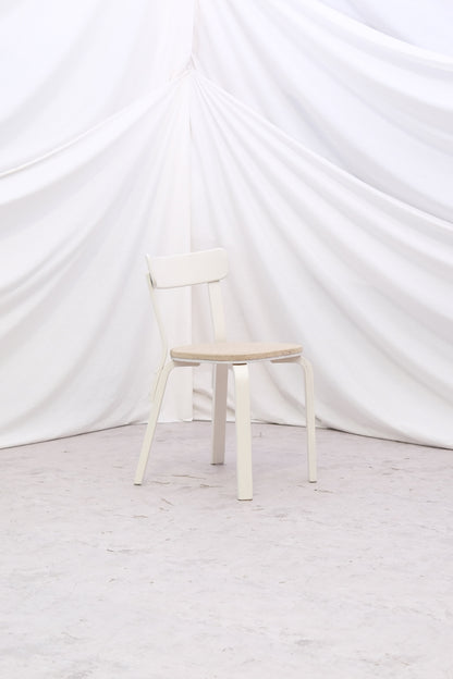 Vintage Alvar Aalto Chair 69 “Sandwich” by Artek with original upholstery and white painted finish with patina. Helsinki pickup and worldwide shipping available.