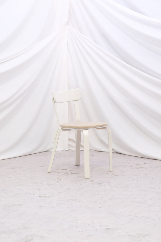 Vintage Alvar Aalto Chair 69 “Sandwich” by Artek with original upholstery and white painted finish with patina. Helsinki pickup and worldwide shipping available.