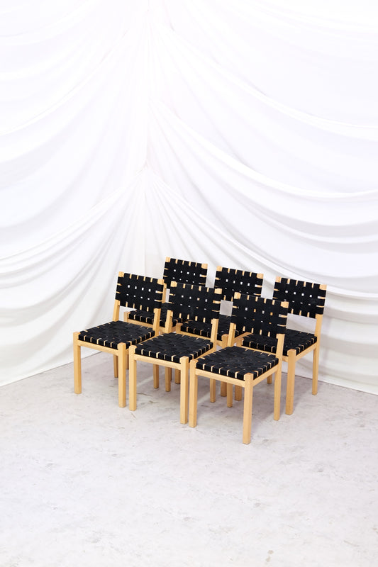 Set of six vintage Artek 615 chairs in birch with black woven seats. Classic Finnish dining chairs. Worldwide shipping available.