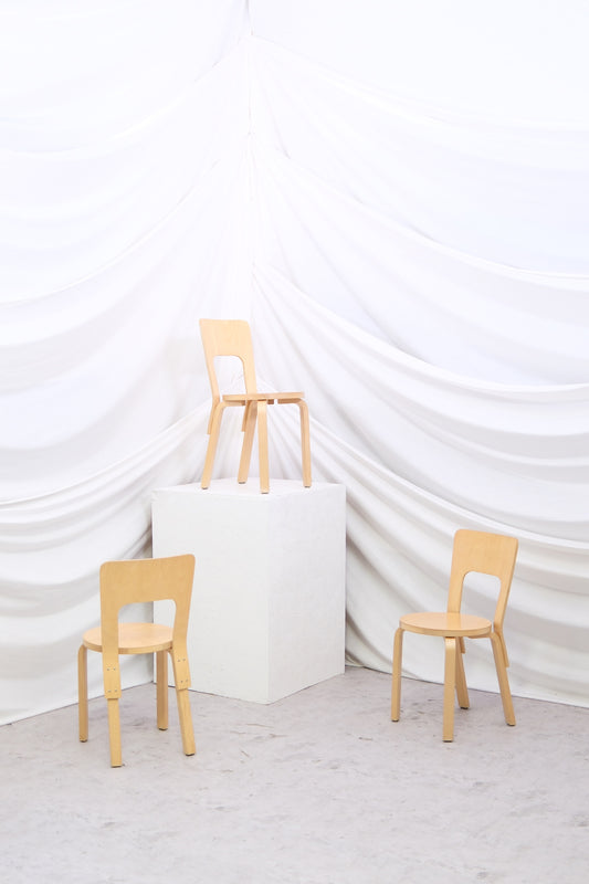 Set of eight vintage Artek 66 chairs in natural birch. Timeless Finnish dining design. Worldwide shipping available.