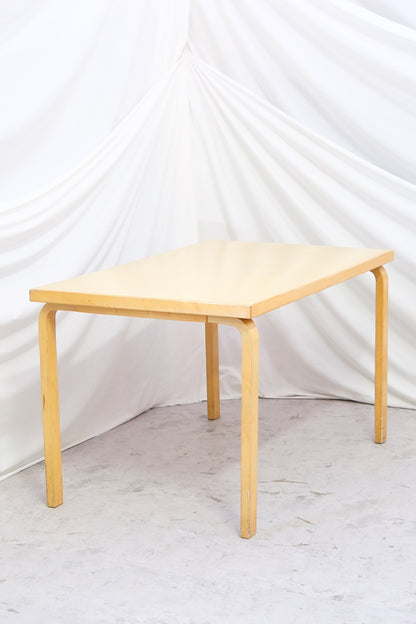Artek 81B dining or work table with yellow laminate top. Honest vintage character and solid structure. Two tables pictured. Worldwide shipping.