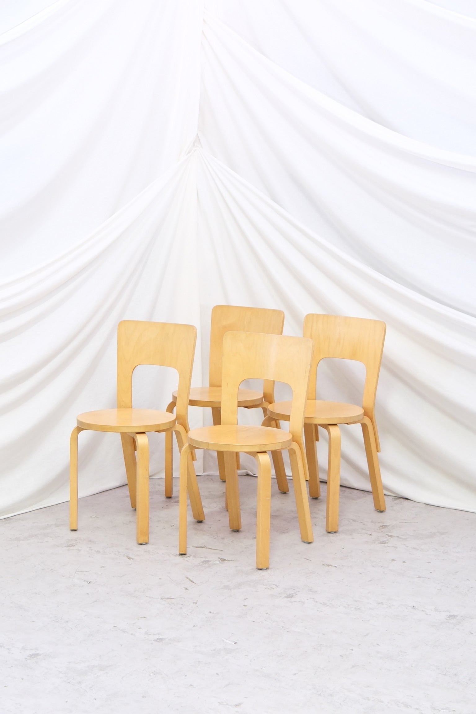 Set of four Alvar Aalto 68 chairs in birch by Artek. Classic Finnish design, good vintage condition. Available individually, worldwide shipping.