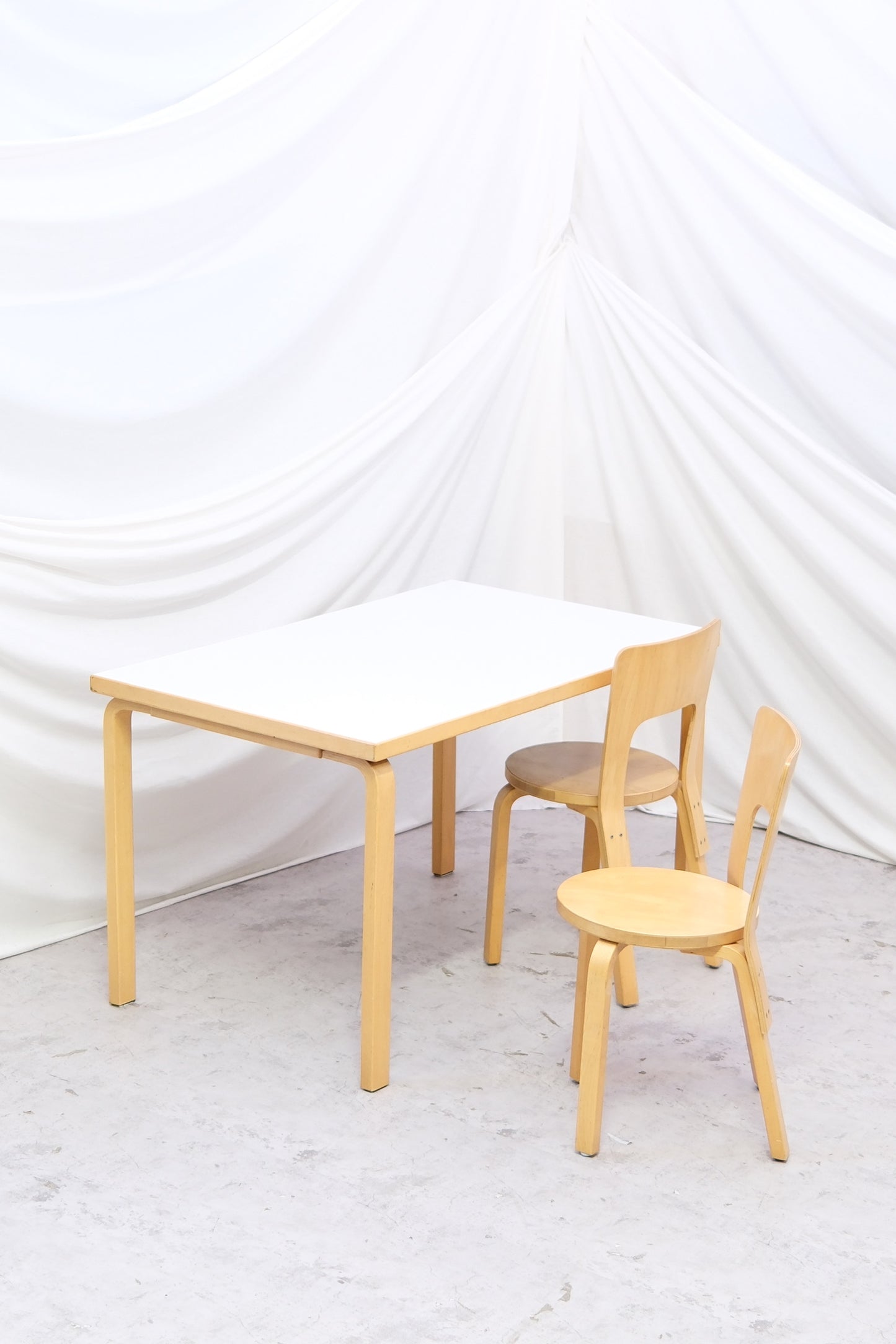 Original Artek 81B dining table by Alvar Aalto with white laminate top and birch legs. Good vintage condition, Finnish modern classic. Worldwide shipping.
