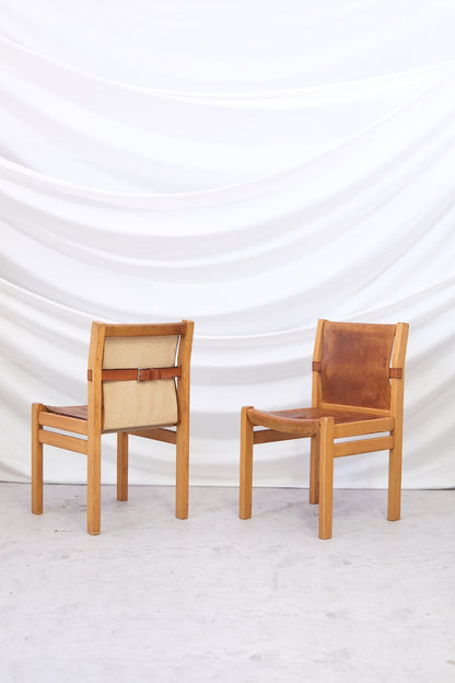 Set of three vintage Artek Safari dining chairs by Pirkko Stenroos with patinated leather seats. Finnish design with worldwide shipping.