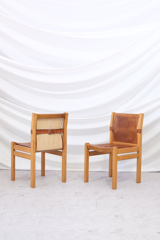 Set of three vintage Artek Safari dining chairs by Pirkko Stenroos with patinated leather seats. Finnish design with worldwide shipping.