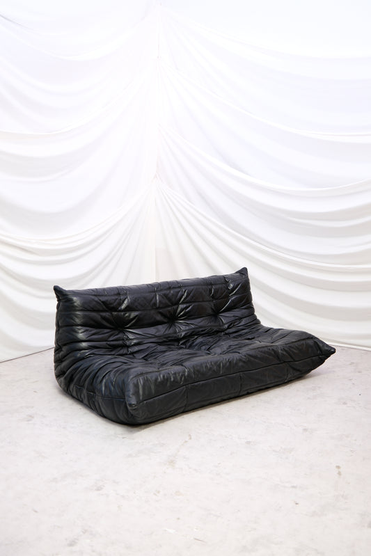 Original Ligne Roset Togo 3-seater sofa by Michel Ducaroy in black leather. Iconic French design classic from the 1970s. Worldwide shipping available.