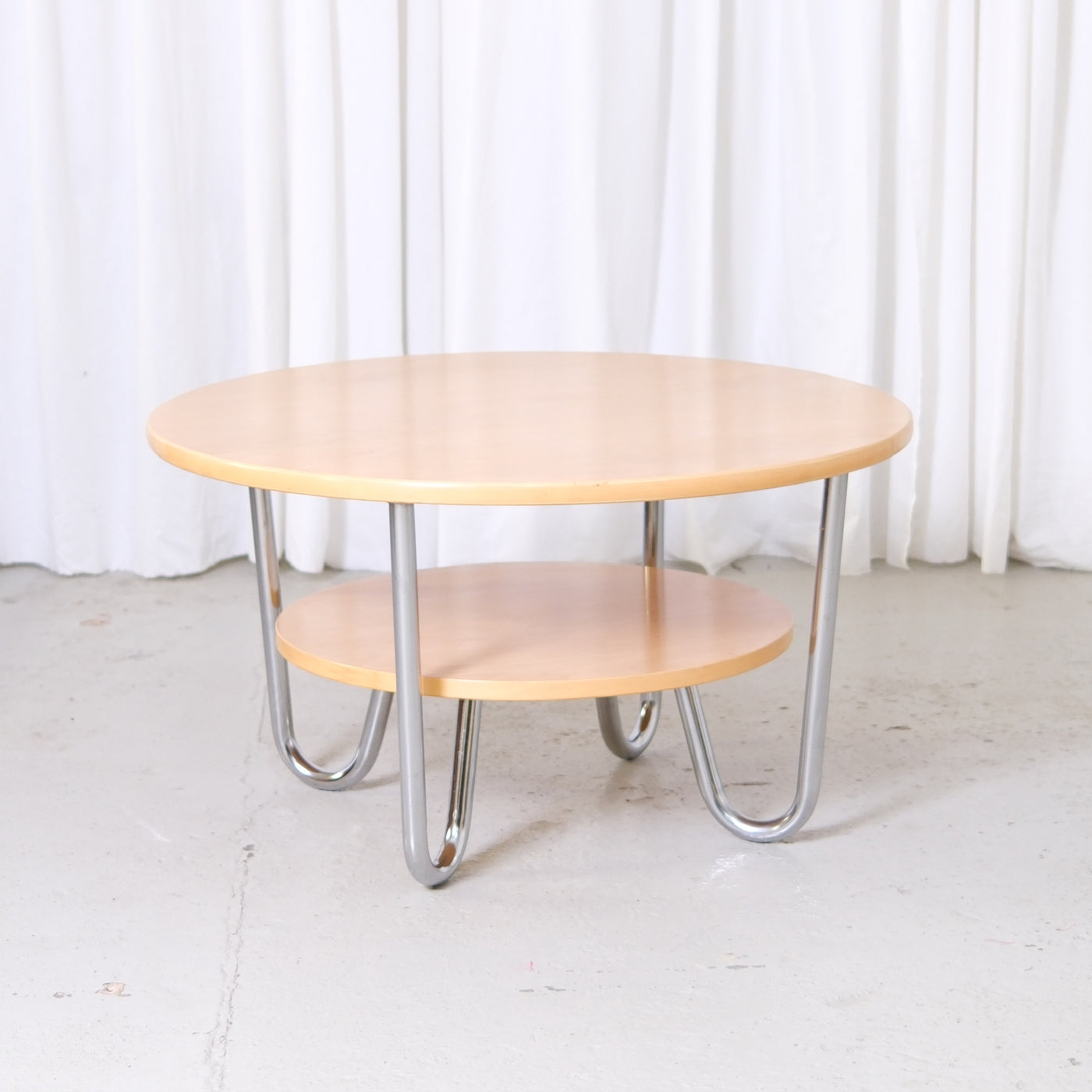 Vintage Pauli Blomstedt round coffee table with chromed tubular legs and lower shelf