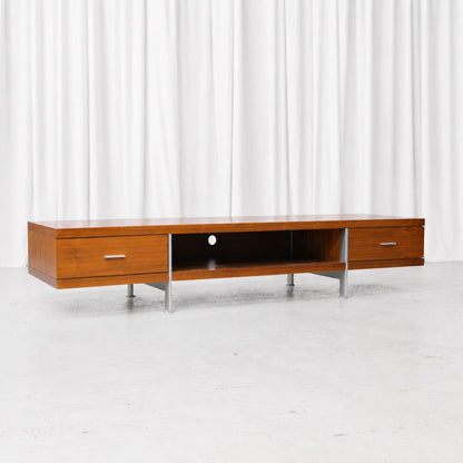 Vintage teak sideboard from the 1960s with a long, low profile, drawers at both ends and open centre storage. Width 200 cm.