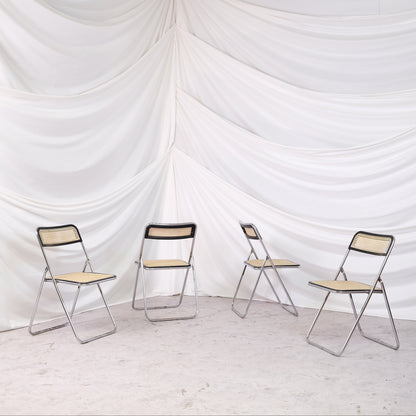 Vintage Unicanna Modulo 31 folding chair with chrome frame and cane seat and back. A practical and distinctive vintage folding chair.