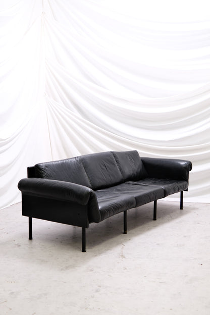 Vintage Yrjö Kukkapuro Ateljee 3-seater sofa by Haimi in black leather with black painted frame. Visible wear and patina. Helsinki pickup and worldwide shipping available.