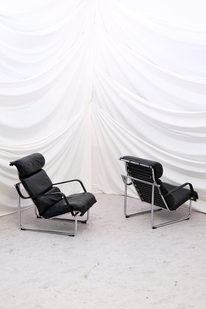 Pair of Yrjö Kukkapuro Remmi lounge chairs for Haimi in black leather with chrome frames. Very good condition. Finnish modern design with worldwide shipping.