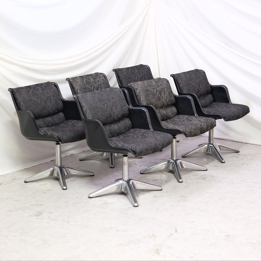 Vintage Yrjö Kukkapuro 3428 dining chairs with swivel function, metal base, and black shell. Sold individually. Available in Helsinki with worldwide shipping and delivery in Finland.