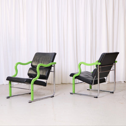 Yrjö Kukkapuro Experiment lounge chair with green lacquered armrests and black leather upholstery

