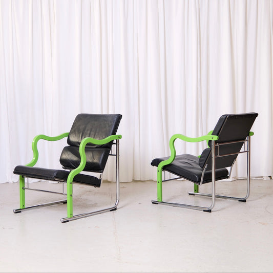 Yrjö Kukkapuro Experiment lounge chair with green lacquered armrests and black leather upholstery
