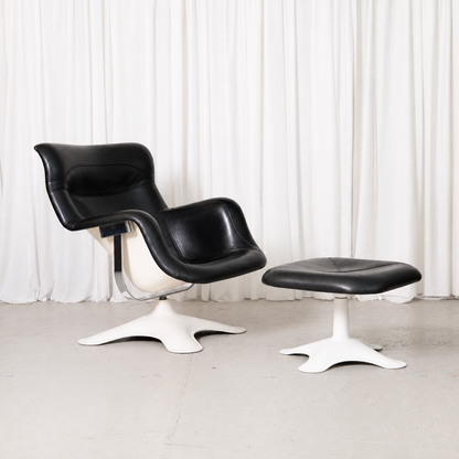 Vintage Yrjö Kukkapuro Karuselli chair and ottoman by Haimi, featuring black leather, a white fibreglass shell and iconic Finnish design.