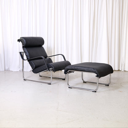 Yrjö Kukkapuro Remmi lounge chair and ottoman in black leather with chrome frame