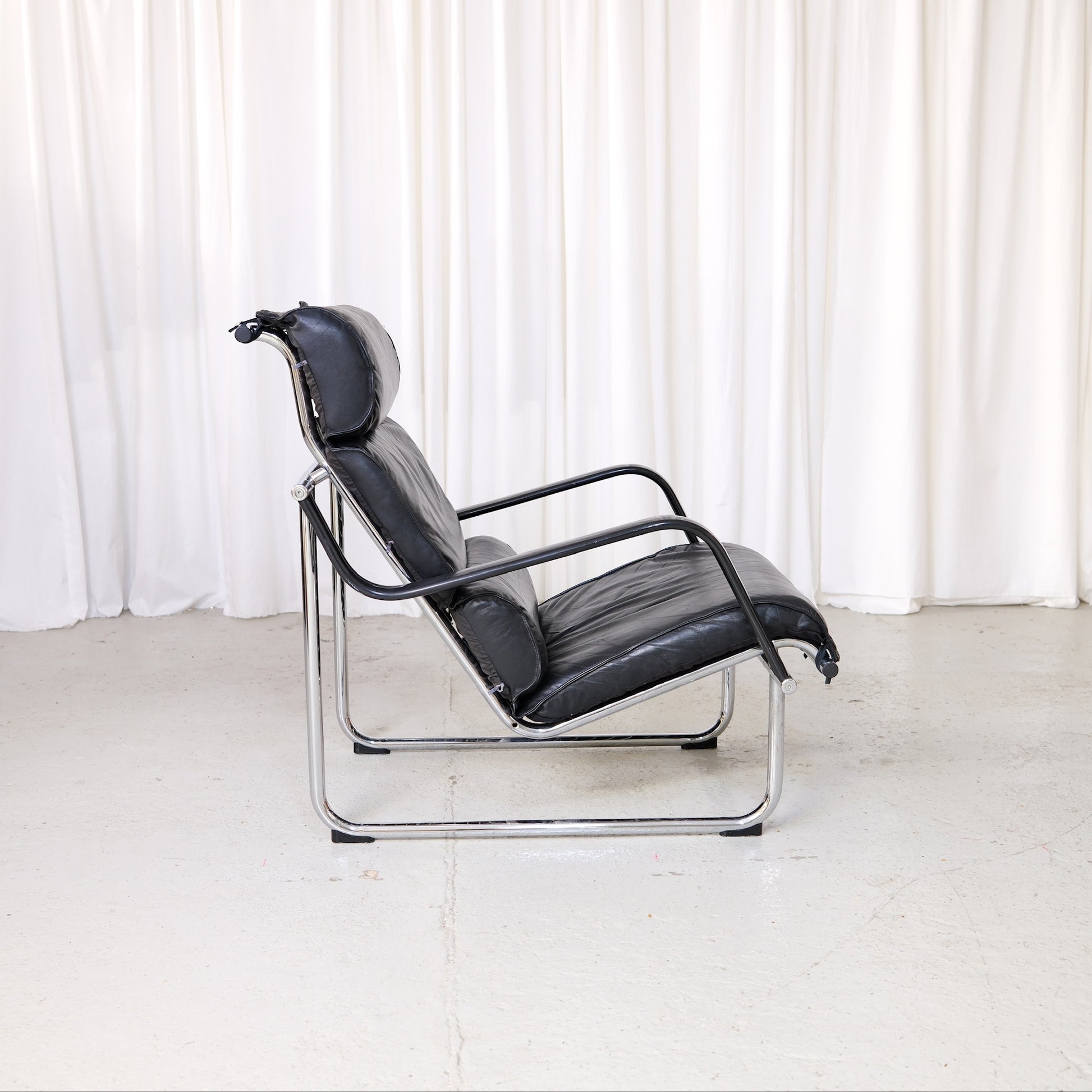 Yrjö Kukkapuro Remmi lounge chair in black leather with chrome tubular steel frame
