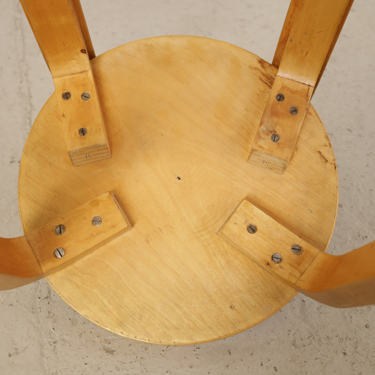 Alvar Aalto Chair 65 in Birch and Red Linoleum for Artek, underside view of Chair 65 showing leg and backrest fixings